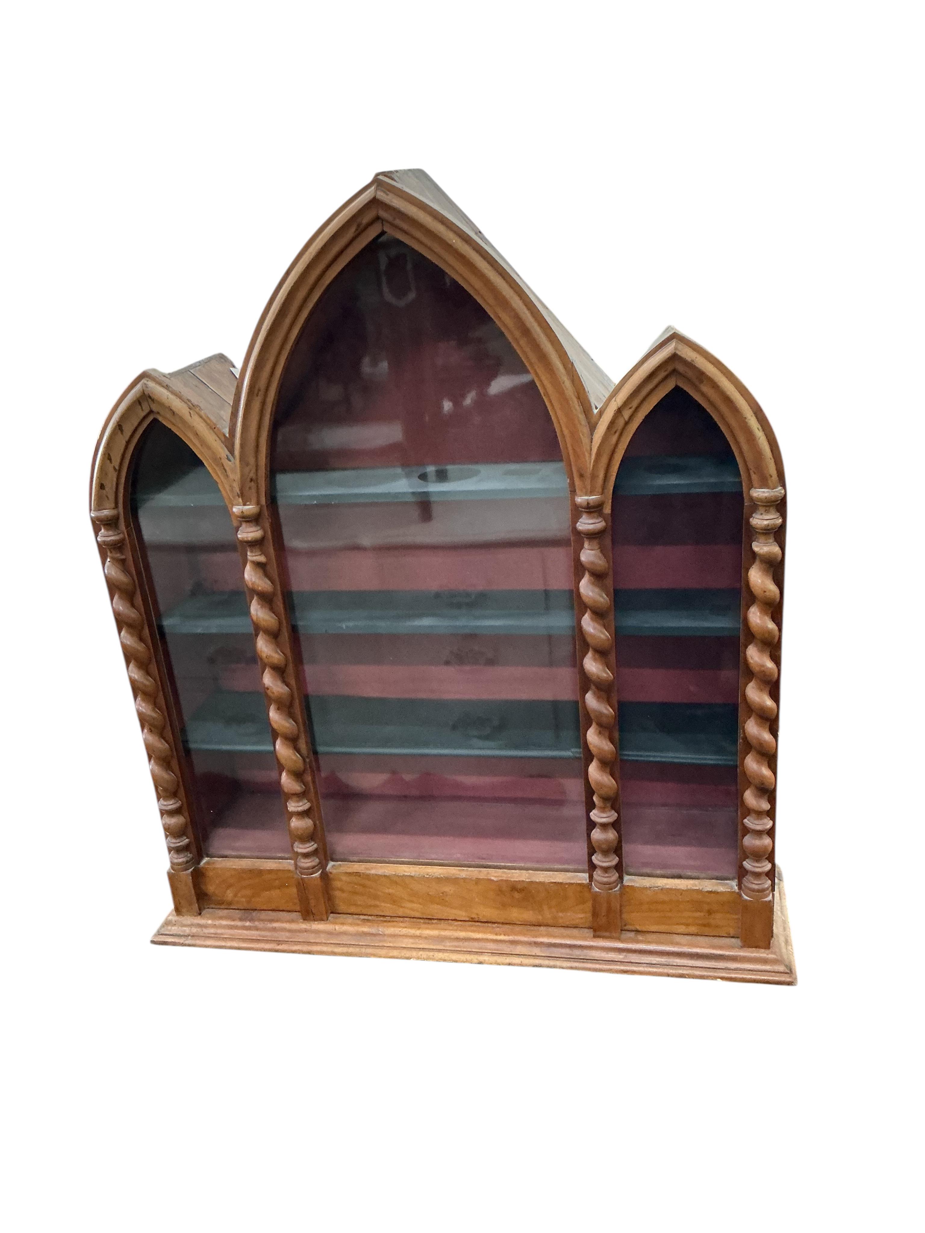 A 19th century French Gothic style walnut and pine triple arched wall display cabinet, width 82cm, depth 32cm, height 97cm